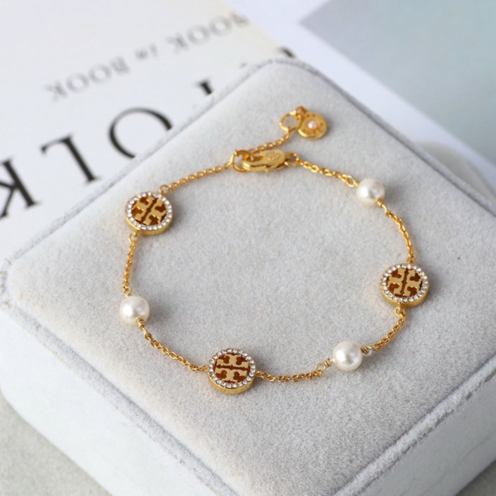 Tory Burch Elegant Gold and Pearl Bracelet